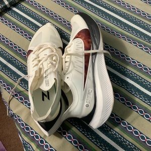 Nike shoes cheetah print on the side.